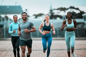 Sculpting Sleek Arms: The Essential Role of Cardio in Toning Without Bulking Up 3 image of people running to incorporate cardio Banbury exercise into their life to help tone arms and body.