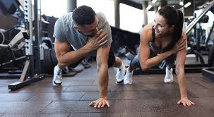 Image of man and woman doing Cardio Banbury to tone their arms. 